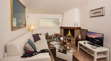 Junior Suite | Living area | 28-inch LED TV with digital channels, TV