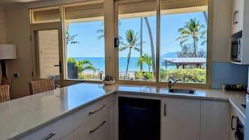 Pet Friendly - Two Bedroom Beachfront Apartment with Yard | Living area | 32-inch LCD TV with digital channels, TV, DVD player