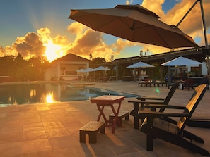 Outdoor pool, open 9:00 AM to 10:00 PM, pool umbrellas, pool loungers