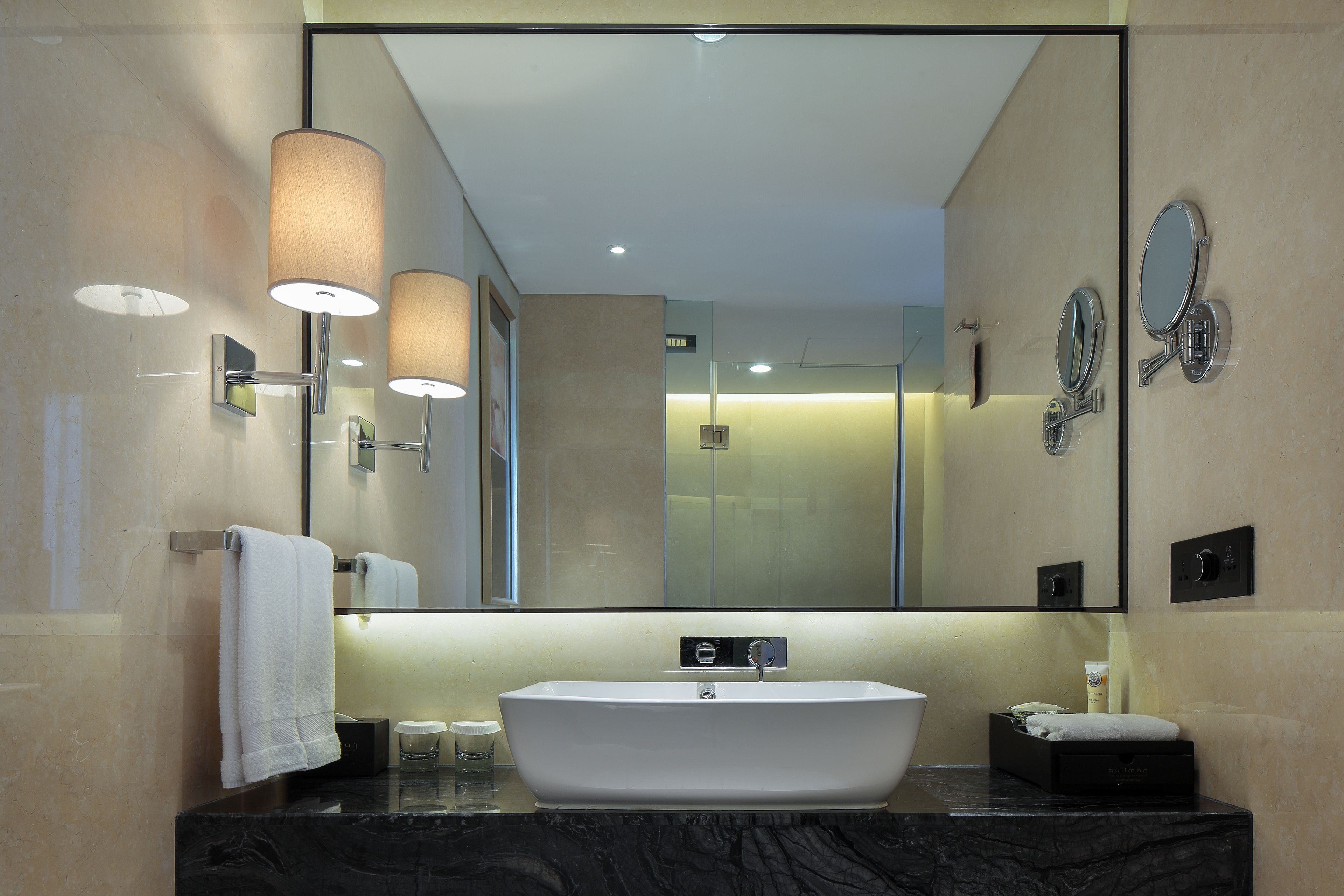 eco-friendly toiletries, hair dryer, slippers, towels