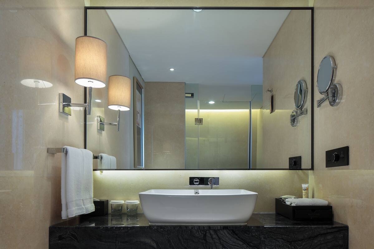 eco-friendly toiletries, hair dryer, slippers, towels