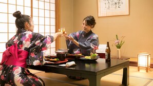 A traditional Japanese room with tatami flooring, a low table, and a tea set. - Nara Park Hotel (Nara)