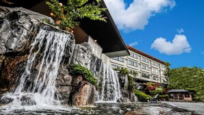 A hotel with a waterfall feature in front of it. - Nara Park Hotel (Nara)