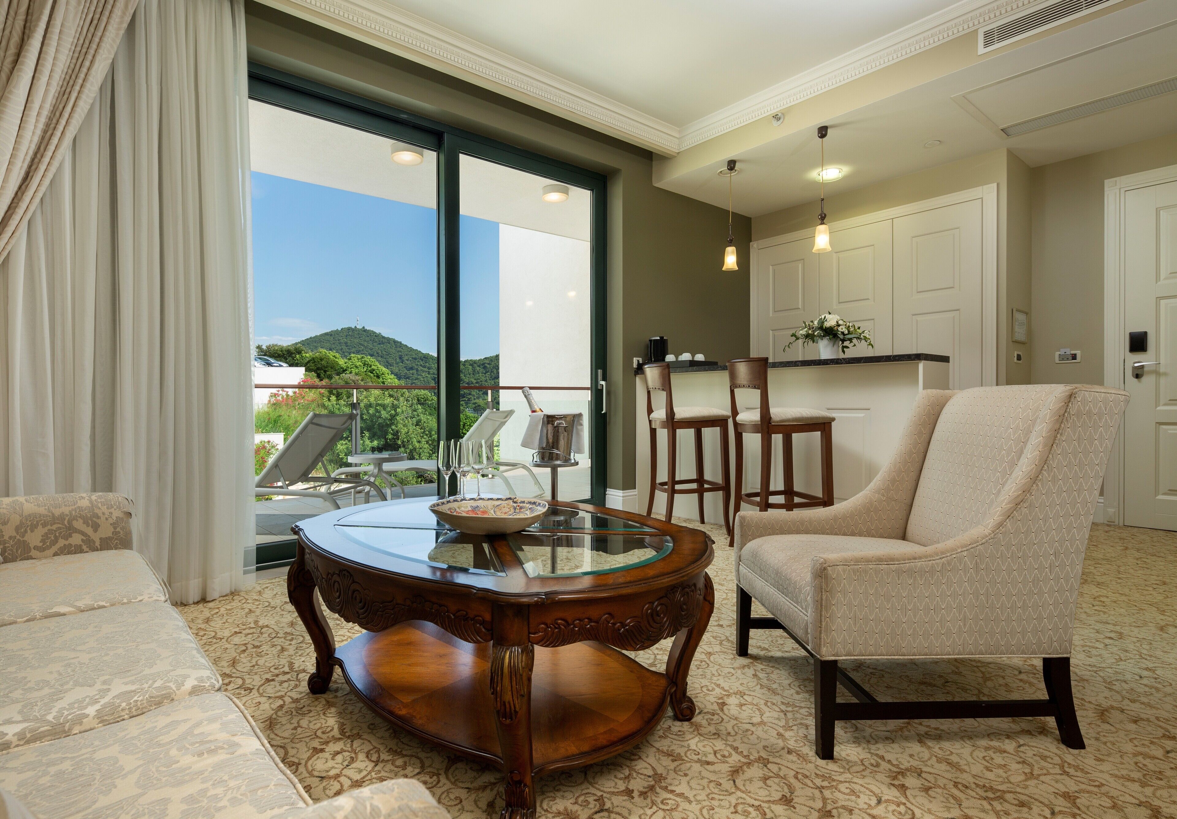 deluxe suite, 1 king bed with sofa bed, balcony | living area | 140-cm lcd tv with satellite channels, tv, fireplace