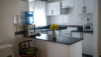 Apartment, 1 Bedroom | Private kitchenette | Coffee/tea maker, electric kettle