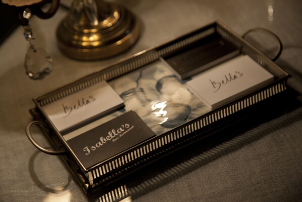 A tray with a name tag, a menu, and a glass.