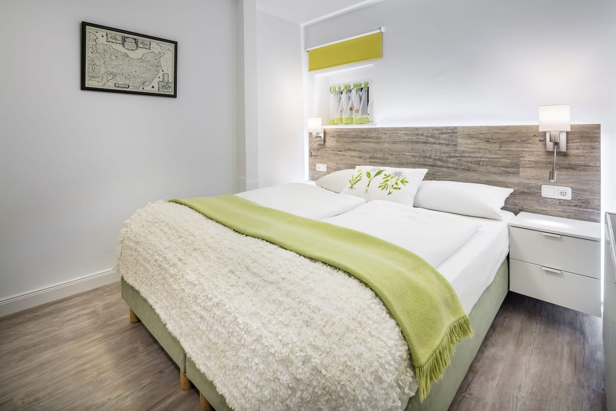 Apartment (A) | Hypo-allergenic bedding available, down comforters, in-room safe, desk