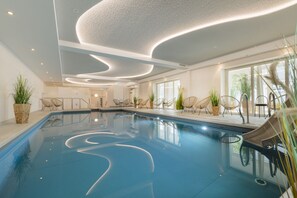 Indoor pool, open 6:00 AM to 9:00 PM, pool loungers