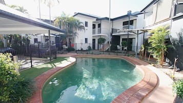 Outdoor pool, open 7:00 AM to 8:00 PM, pool loungers