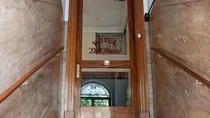 A staircase leading to a hotel entrance with a sign reading "HOTEL De Prado". - Hotel del Prado (Buenos Aires)