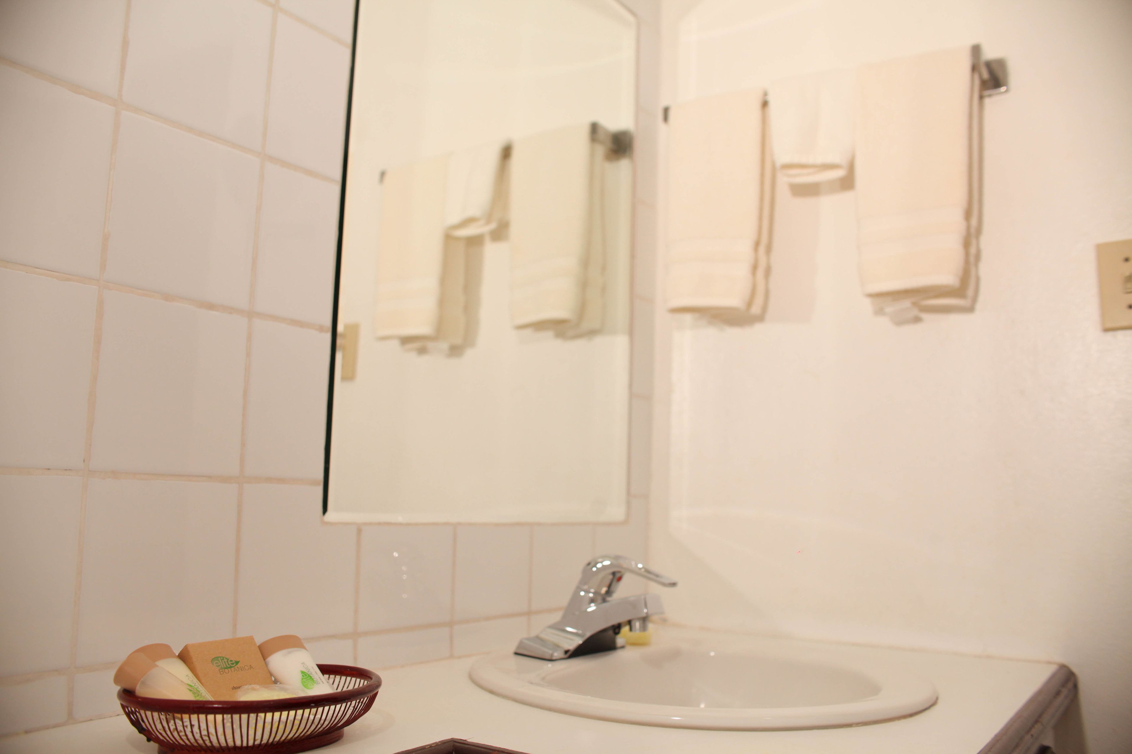 executive queen room, 2 queen beds | bathroom | shower, free toiletries, towels