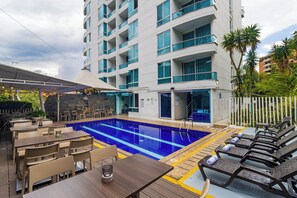 Outdoor pool, open 10:00 AM to 9:30 PM, pool loungers