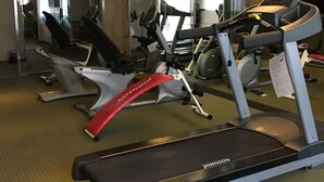 A gym with stationary bikes, treadmills, and exercise equipment. - Park City Central (Taichung)