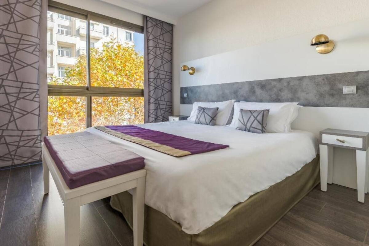 Premium bedding, desk, laptop workspace, blackout curtains