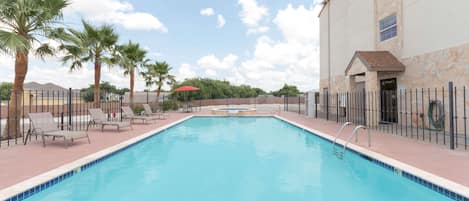 Seasonal outdoor pool, open 9:00 AM to 10:00 PM, pool loungers