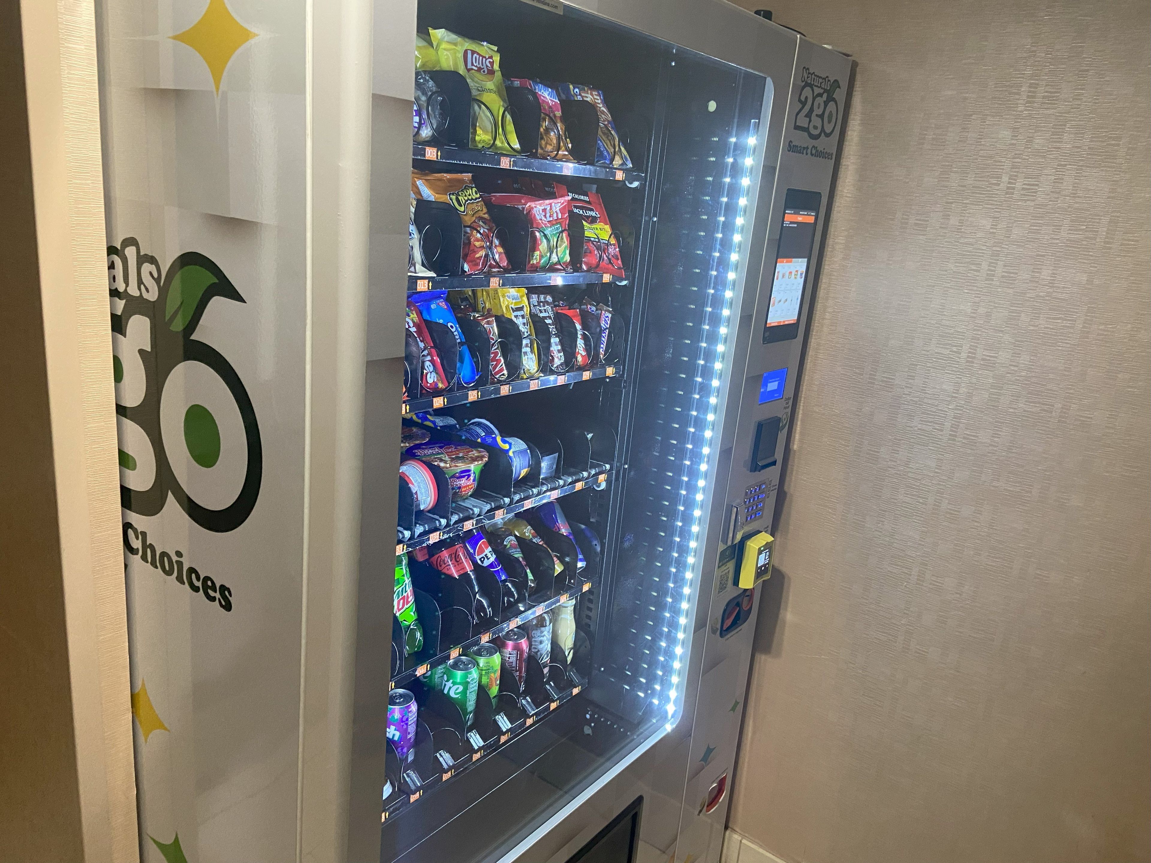 A vending machine with various snacks and drinks.