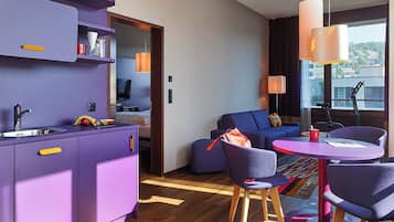 Cozy living space with a kitchen, dining area, and seating area.