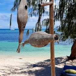 On the beach, white sand, beach towels, scuba diving
