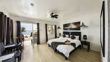 Deluxe Room, Sea View | Minibar, in-room safe, bed sheets