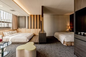A modern hotel room with two beds, a sofa, a TV, and a minibar. - HOTEL GEIGHT TAIPEI (New Taipei City)