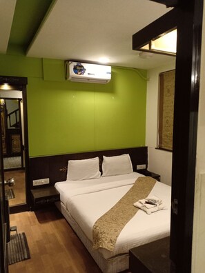 Deluxe Room, 1 Queen Bed | Down comforters, minibar, in-room safe, individually decorated