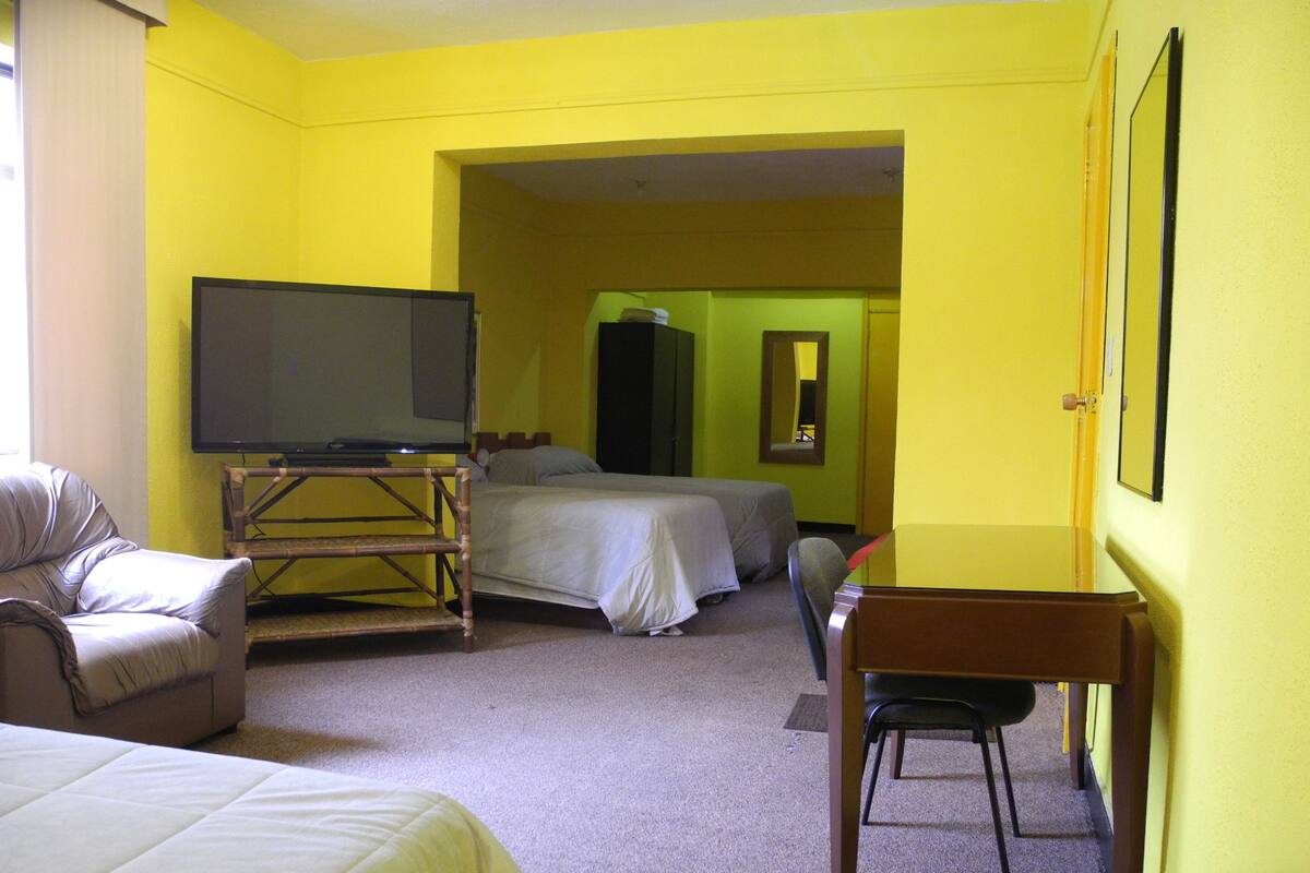 Quadruple Room | Living room | 40-inch flat-screen TV with cable channels, TV, first-run films