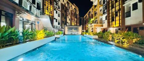 2 outdoor pools, open 9:00 AM to 8:00 PM, pool umbrellas, pool loungers