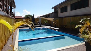Outdoor pool, pool umbrellas, sun loungers