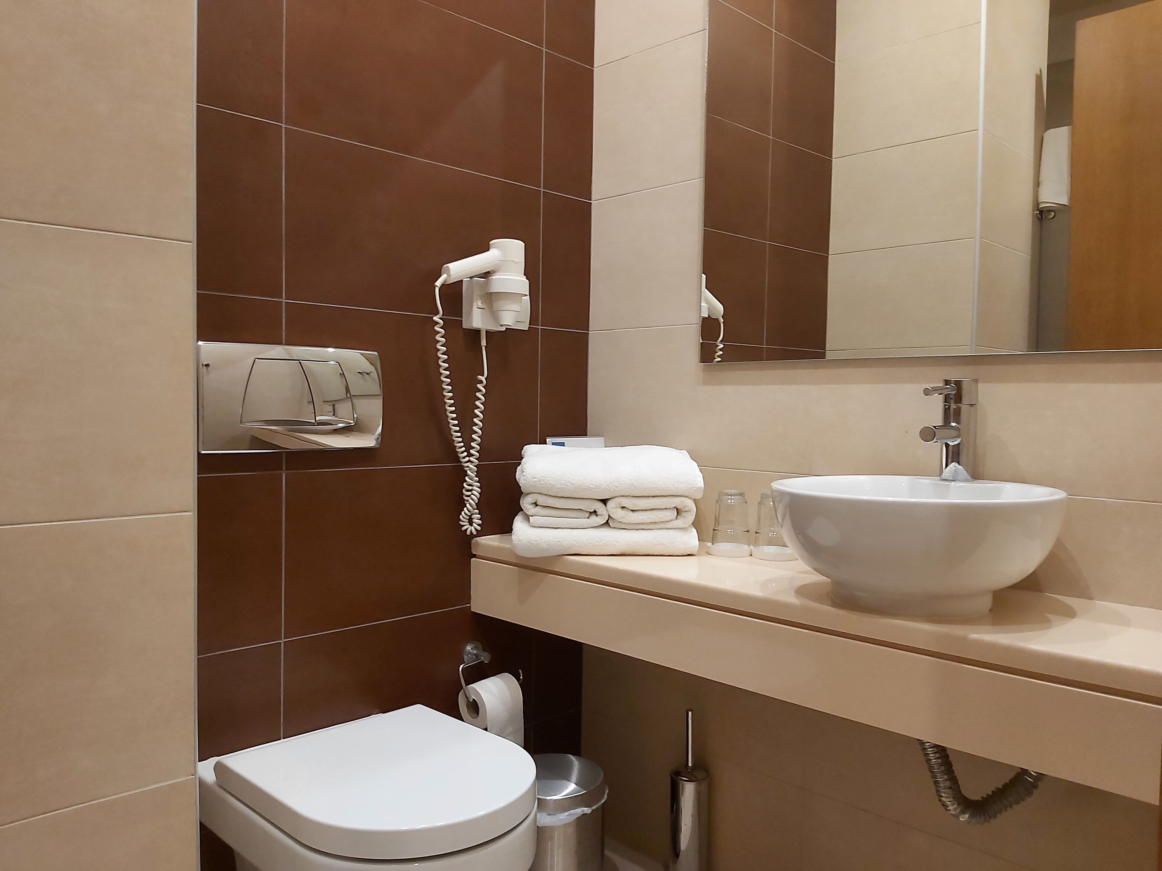 deep-soaking bathtub, designer toiletries, hair dryer, bathrobes