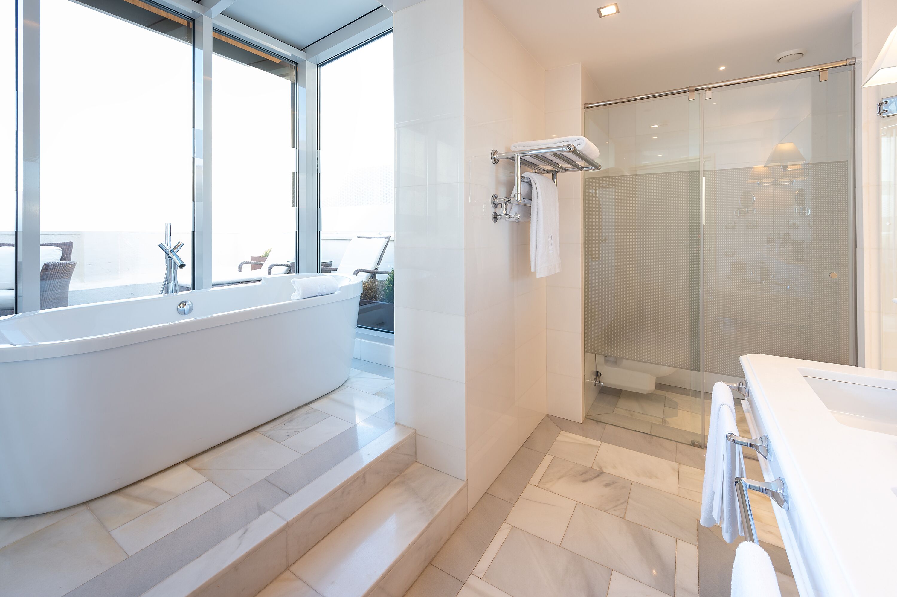 junior suite, terrace | bathroom | combined shower/bathtub, deep-soaking bathtub, eco-friendly toiletries