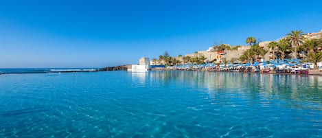 Outdoor pool, pool umbrellas, pool loungers