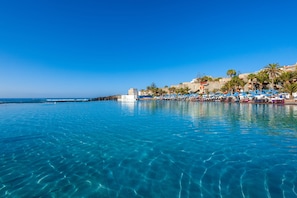 Outdoor pool, pool umbrellas, sun loungers
