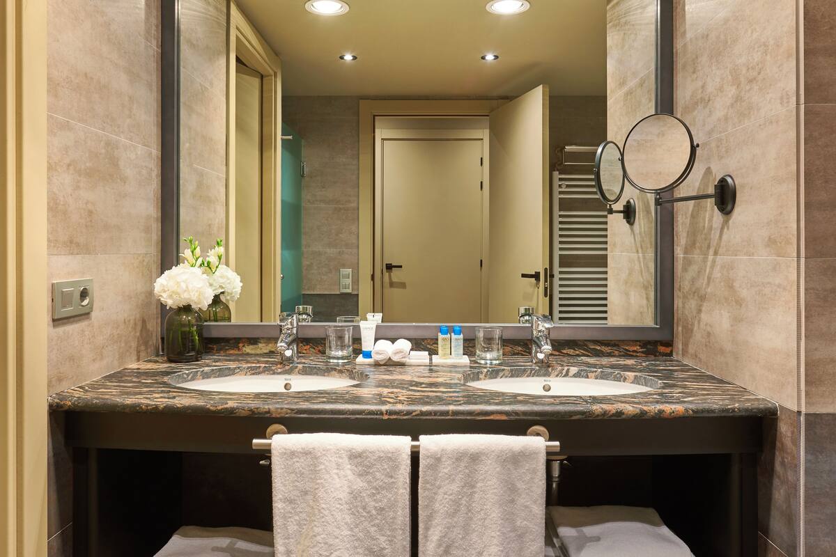 eco-friendly toiletries, hair dryer, bathrobes, slippers