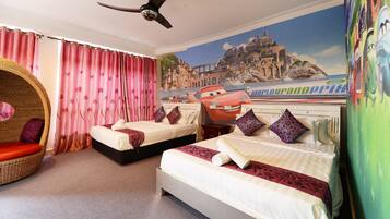 Relax in comfort with two single beds, a wicker chair, and a scenic mural.
