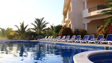 Outdoor pool, pool umbrellas, pool loungers