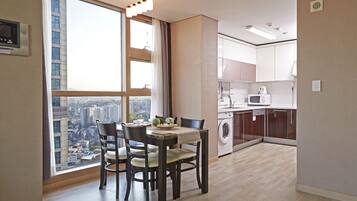 Penthouse | Private kitchen | Fridge, microwave, coffee/tea maker, cookware/dishes/utensils