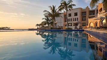 2 outdoor pools, open 7:00 AM to 7:00 PM, pool umbrellas, pool loungers