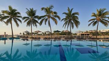 2 outdoor pools, open 7:00 AM to 7:00 PM, pool umbrellas, pool loungers