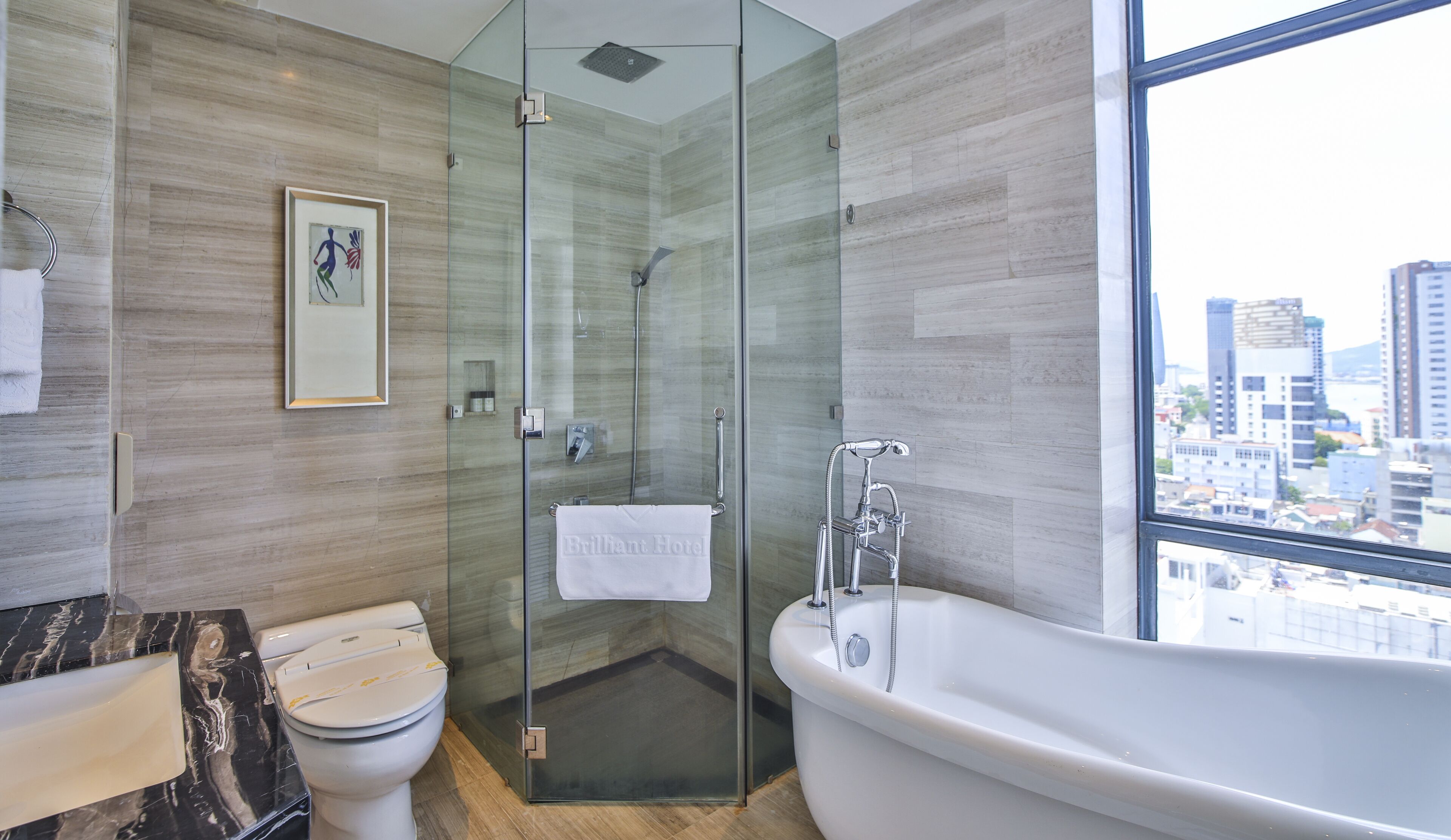 A modern bathroom with a glass-enclosed shower, a freestanding bathtub, and a marble countertop.