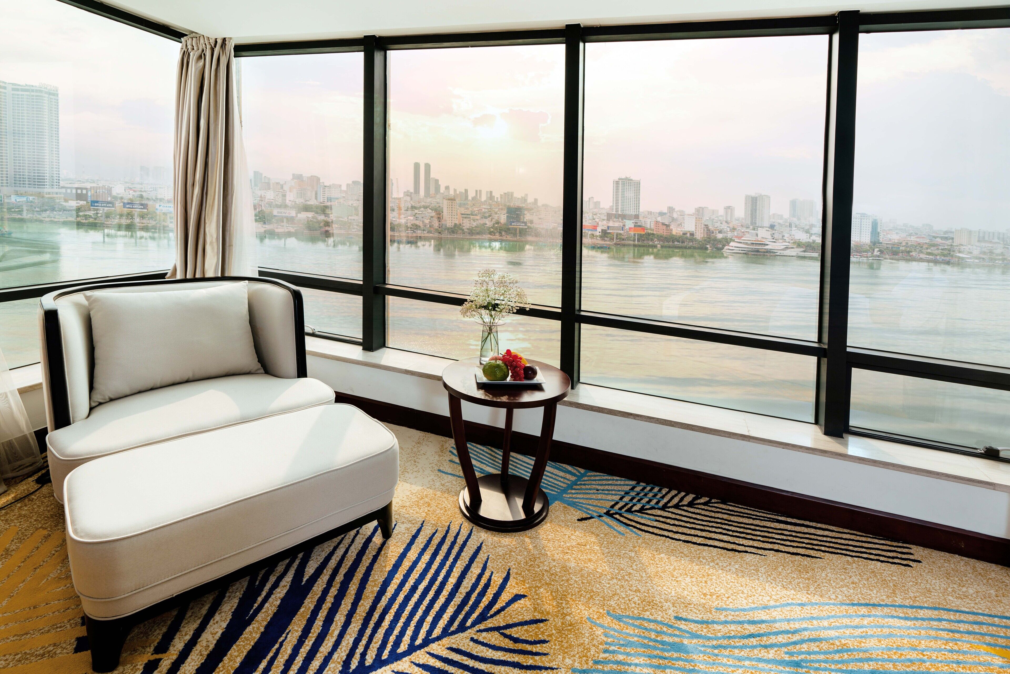 grand suite double river front | living area | flat-screen tv, ipod dock