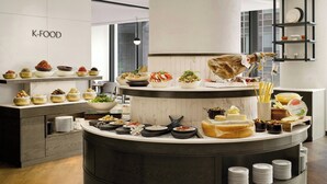 A buffet setup with various dishes and a 'K-FOOD' sign on the wall. - AC Hotel by Marriott Seoul Gangnam (Seoul)
