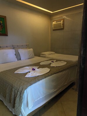 Habitación triple | 1 habitación y camas Select Comfort 