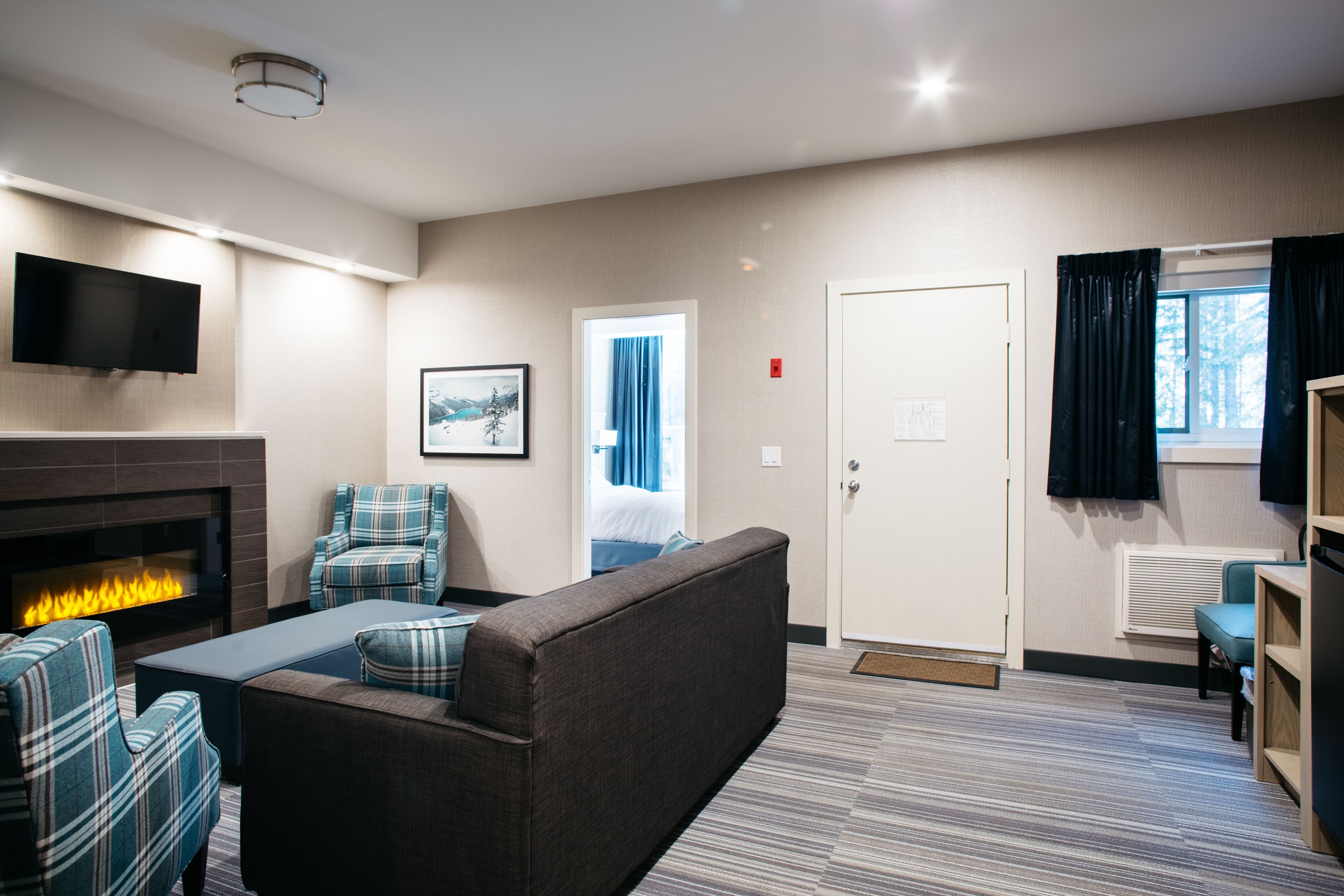 king family suite with fireplace - not pet friendly | living area | tv