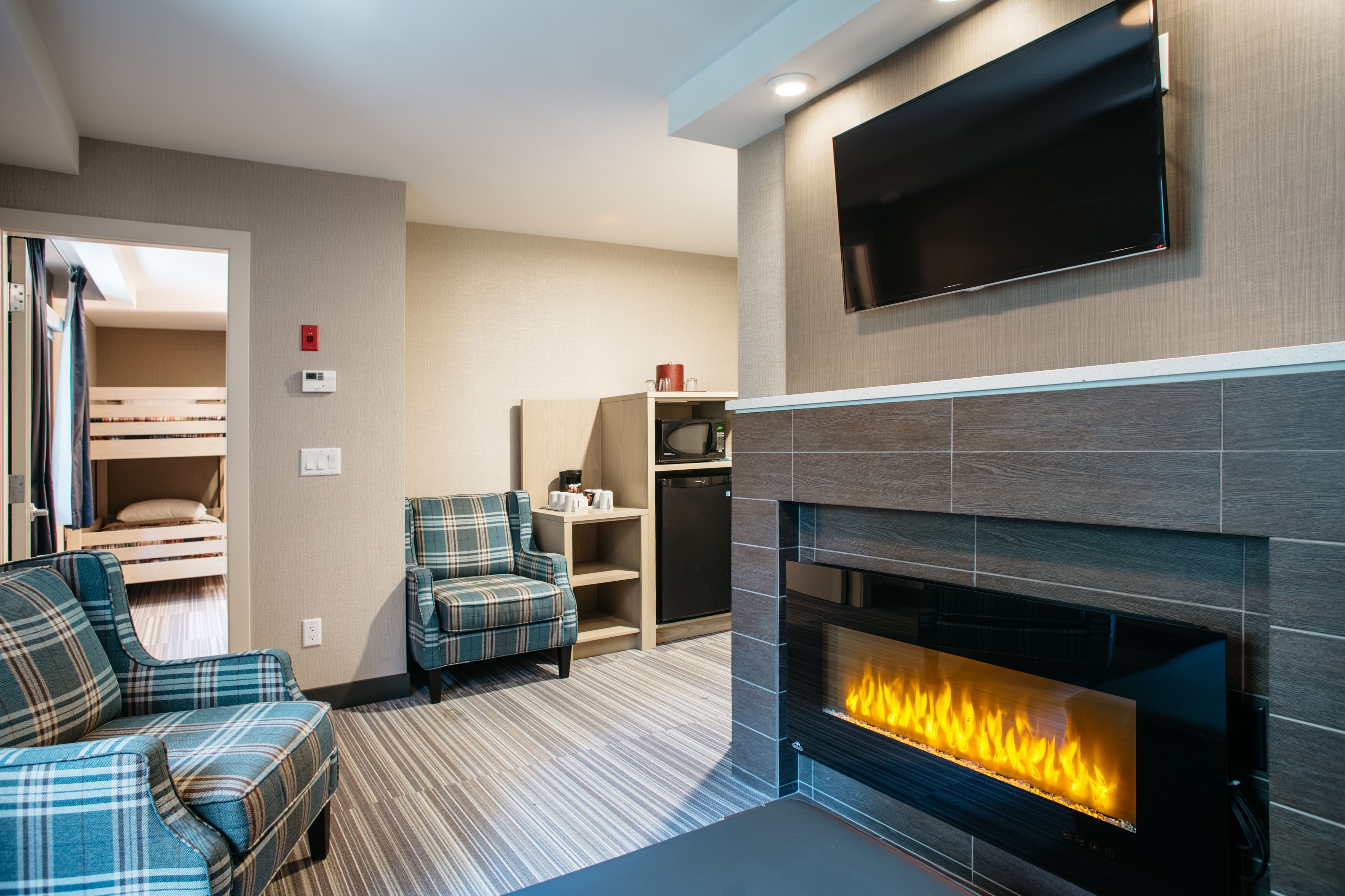 queen family suite with fireplace (not pet friendly) | living area | tv