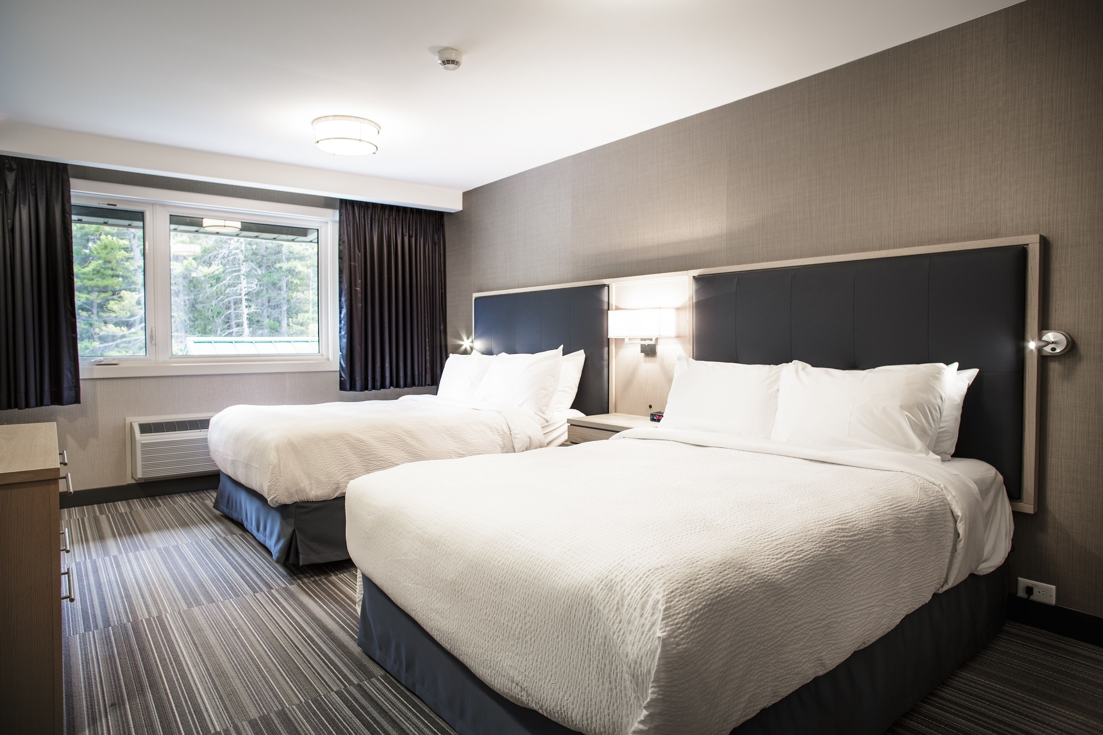 two queen deluxe suite with fireplace (not pet friendly) | 1 bedroom, down duvets, in-room safe, laptop workspace