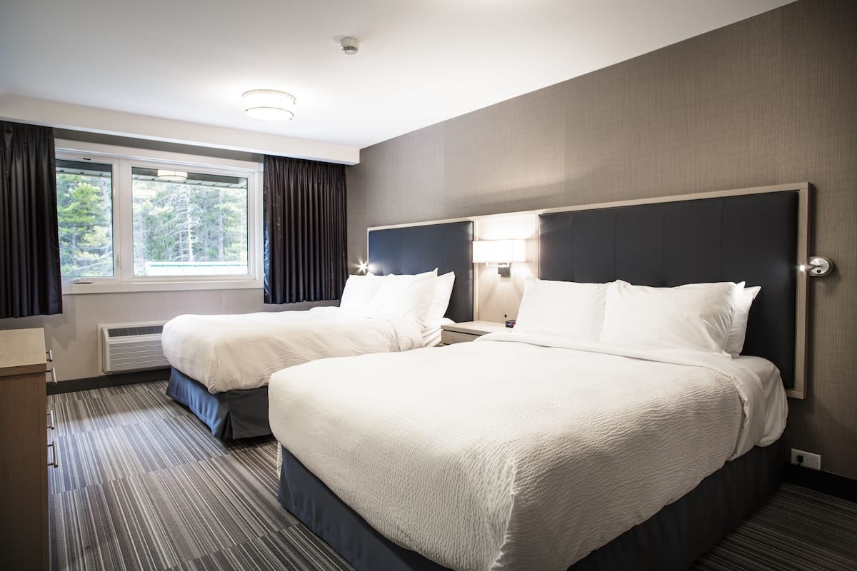 two queen deluxe suite with fireplace (not pet friendly) | 1 bedroom, down duvets, in-room safe, laptop workspace