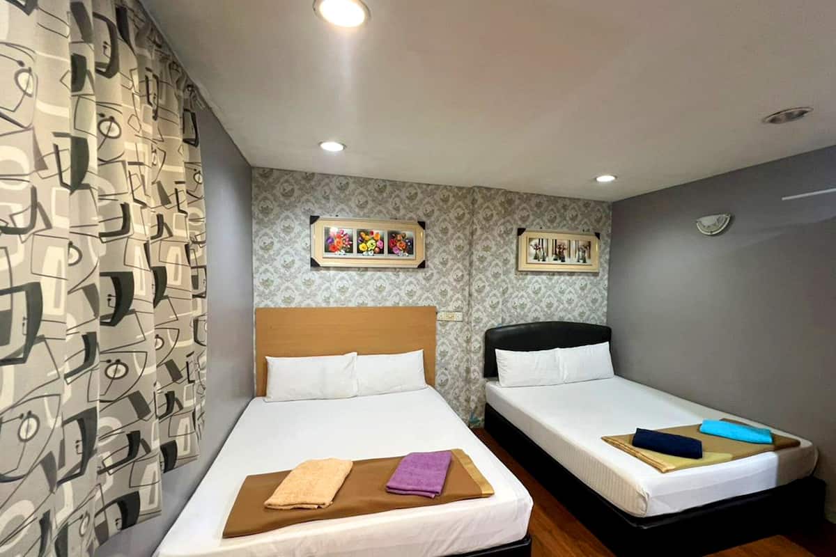 Quadruple Room, 2 Queen Beds | Desk, iron/ironing board (on request), WiFi (free), bed sheets