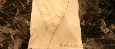 A plastic bag with text on it, placed on a marble surface.
