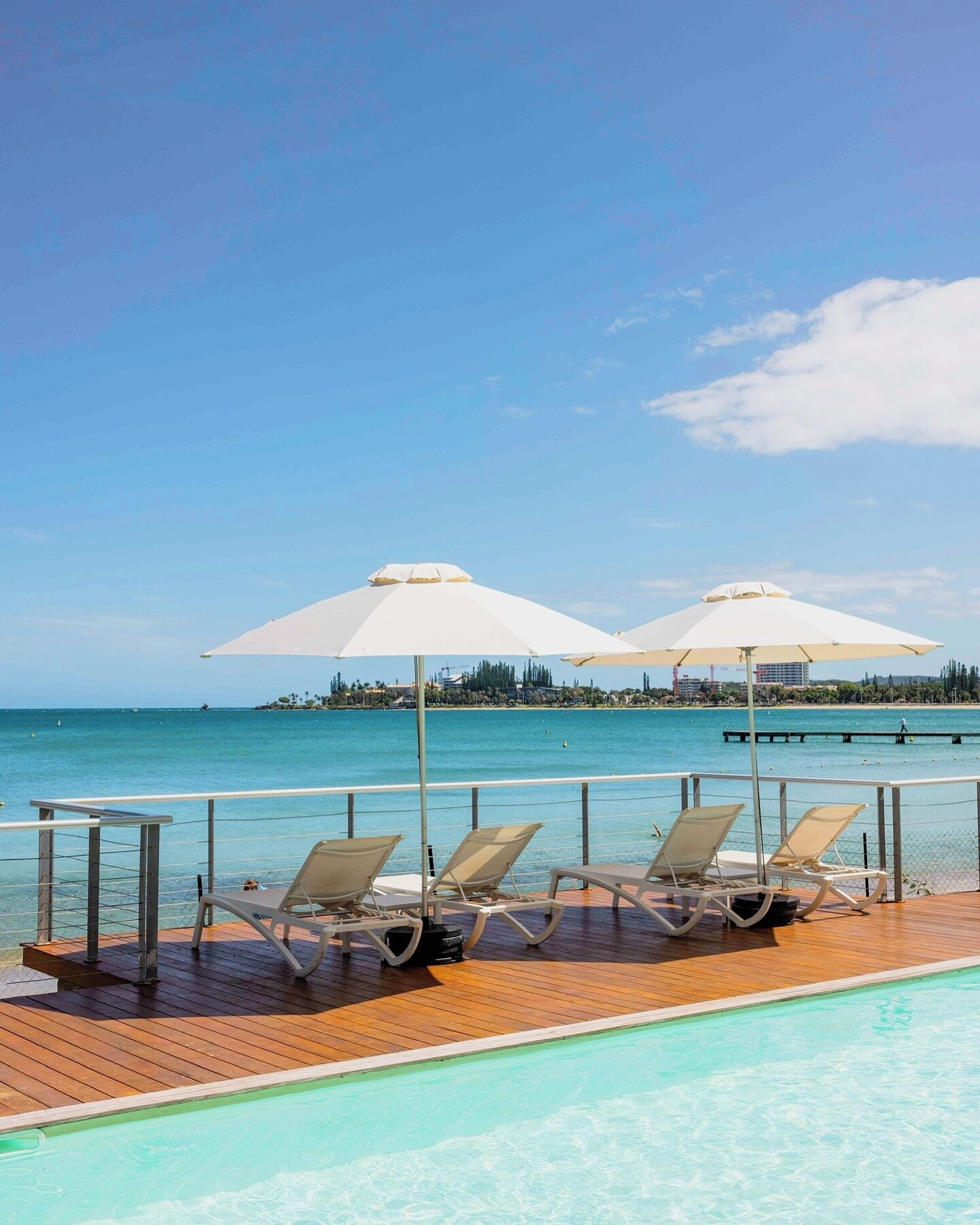 outdoor pool, open 8:30 am to 7:00 pm, pool umbrellas, pool loungers