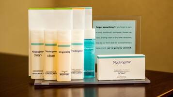 A display of Neutrogena personal care products including shampoo, conditioner, body lotion, and soap.